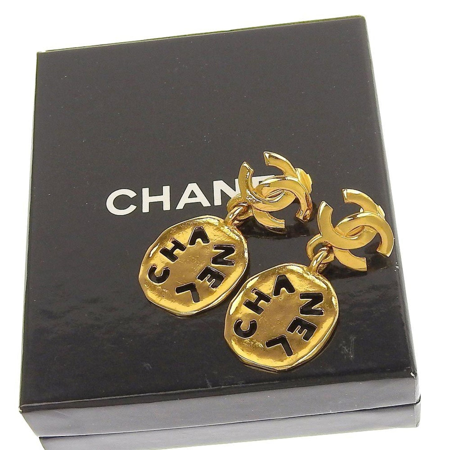 Chanel earrings here mark gold logo vintage