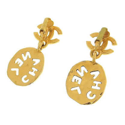 Chanel earrings here mark gold logo vintage