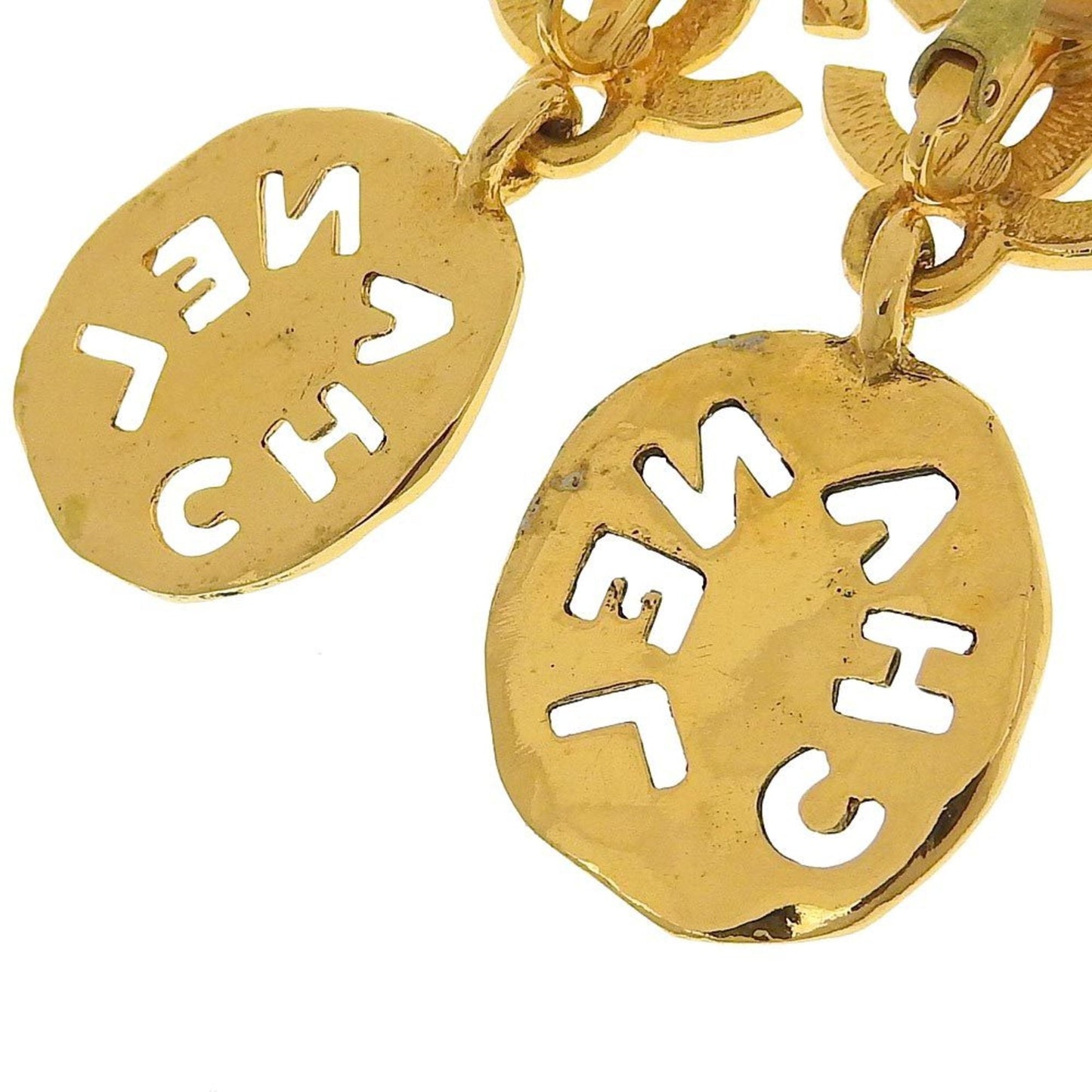 Chanel earrings here mark gold logo vintage