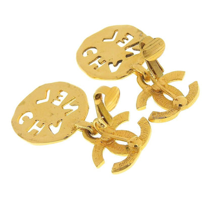 Chanel earrings here mark gold logo vintage