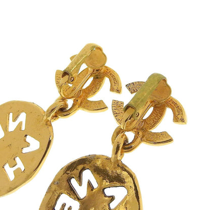 Chanel earrings here mark gold logo vintage