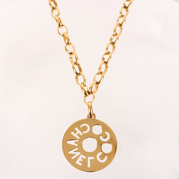 CHANEL Round Cutout Logo Plate Necklace