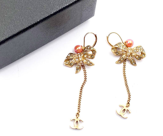 CHANEL Vintage Gold Plated Ribbon Crystal Coral CC Dangle Lever Back Earrings