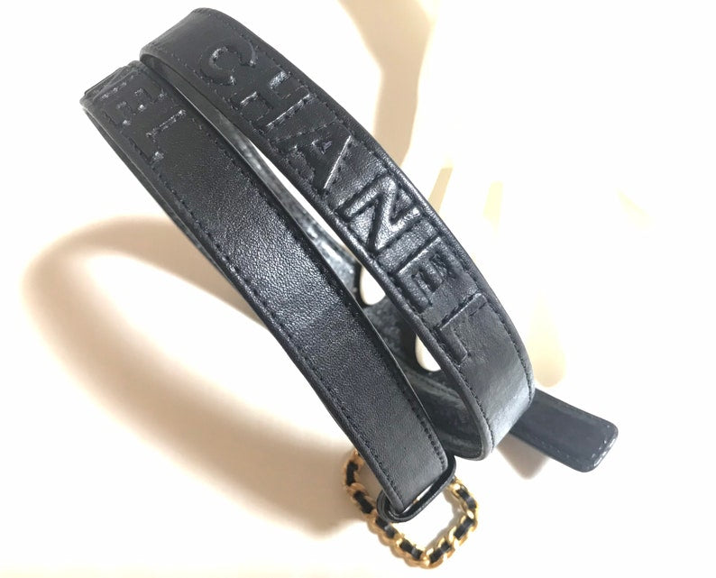 CHANEL Vintage black skinny belt with golden chain buckle and logo stitch