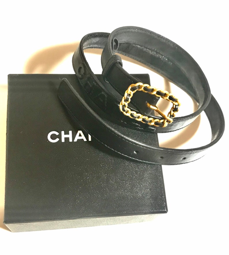 CHANEL Vintage black skinny belt with golden chain buckle and logo stitch