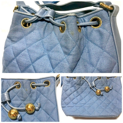 CHANEL Vintage blue quilted canvas and leather combo hobo bucket shoulder bag with drawstrings and golden CC mark balls