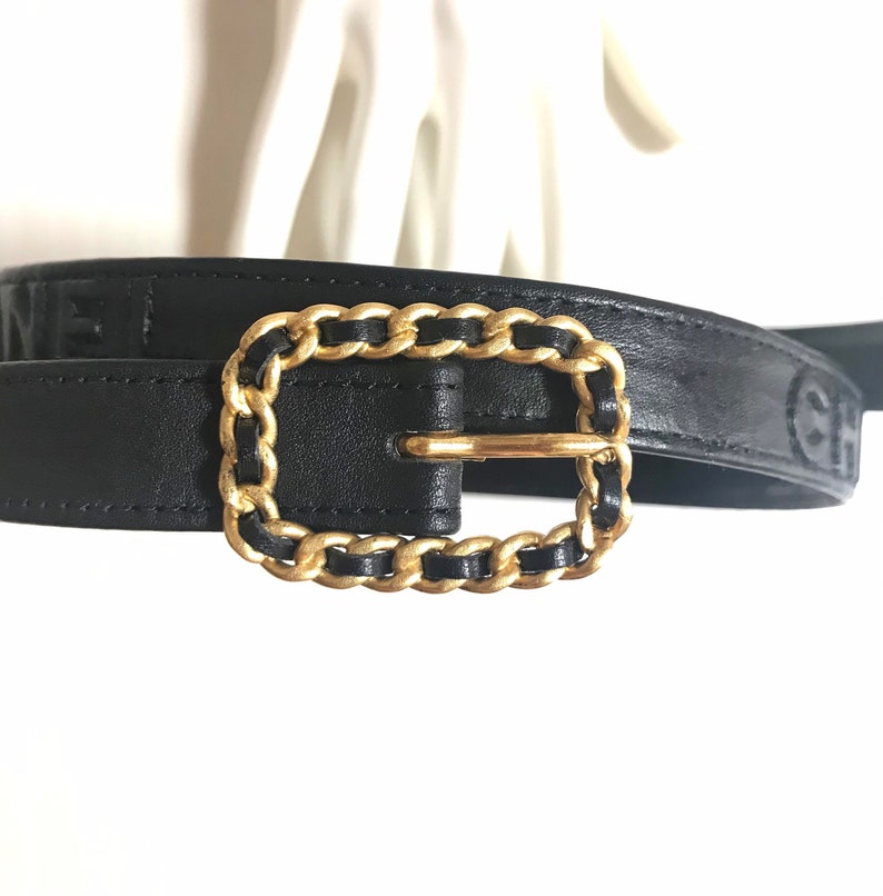 CHANEL Vintage black skinny belt with golden chain buckle and logo stitch