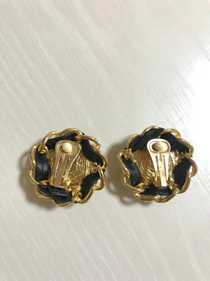 CHANEL Vintage earrings with golden CC, faux pearl, black leather and chain frame