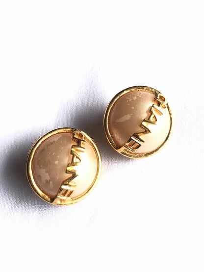 CHANEL Vintage gold tone round earrings with faux pearl and logo on it