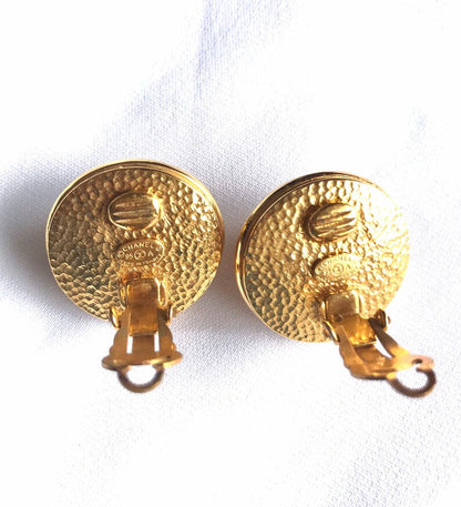 CHANEL Vintage gold tone round earrings with faux pearl and logo on it