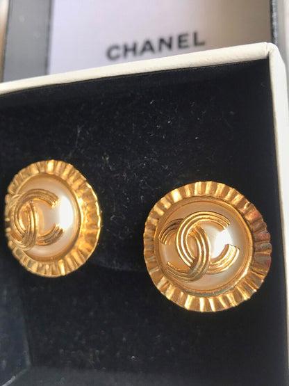 CHANEL Vintage golden round earrings with sun and CC mark motif faux pearl