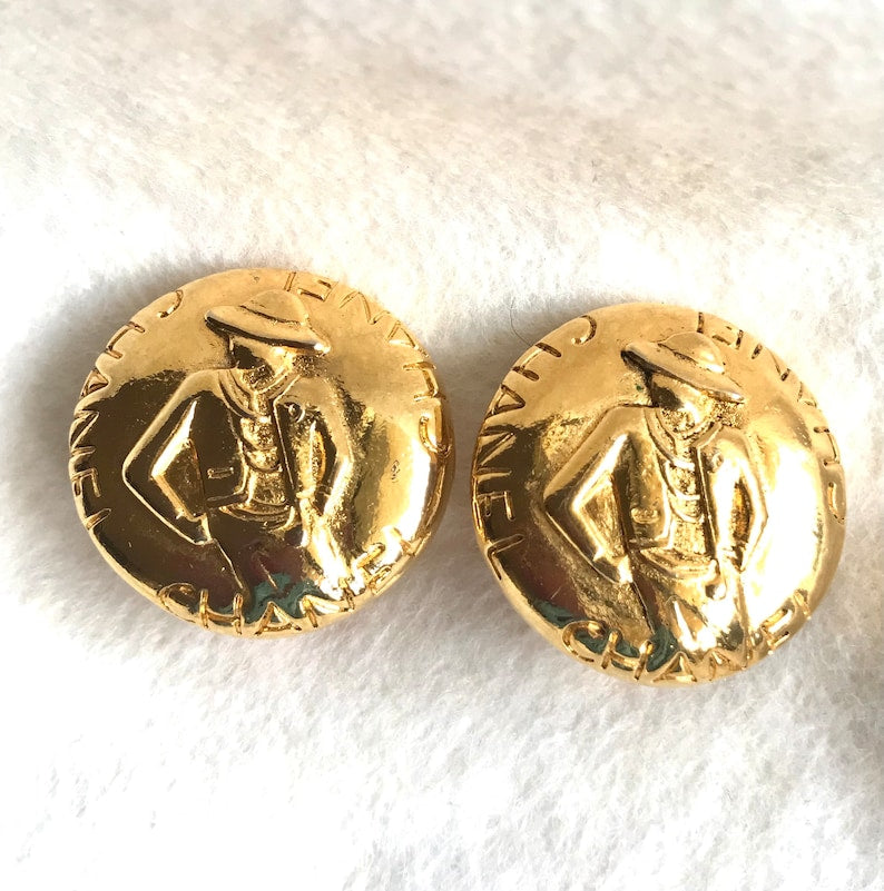 CHANEL Vintage gold tone round earrings with mademoiselle figure