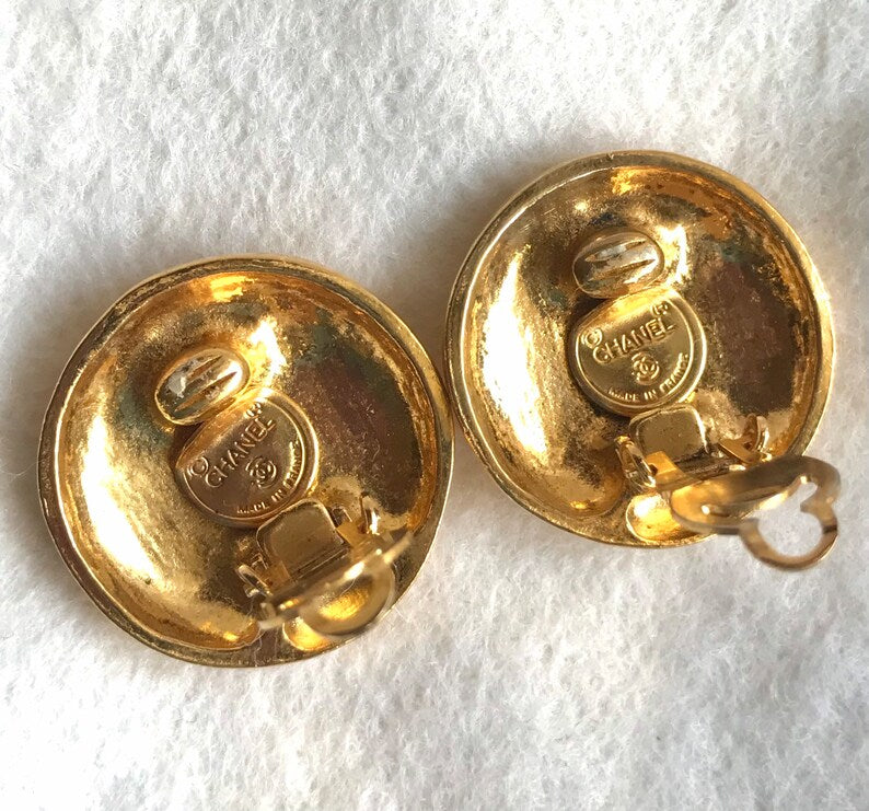 CHANEL Vintage gold tone round earrings with mademoiselle figure