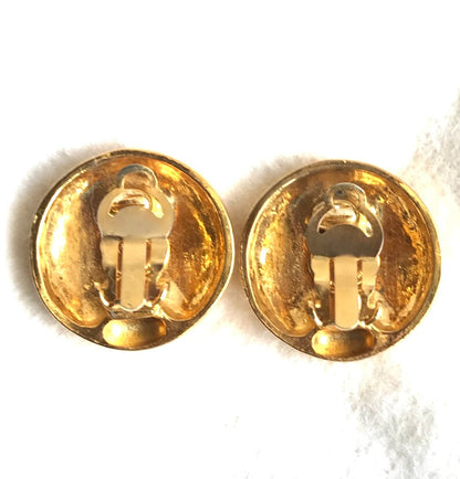 CHANEL Vintage gold tone round earrings with mademoiselle figure