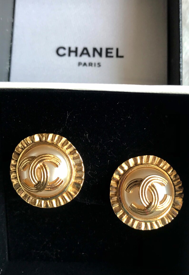 CHANEL Vintage golden round earrings with sun and CC mark motif faux pearl