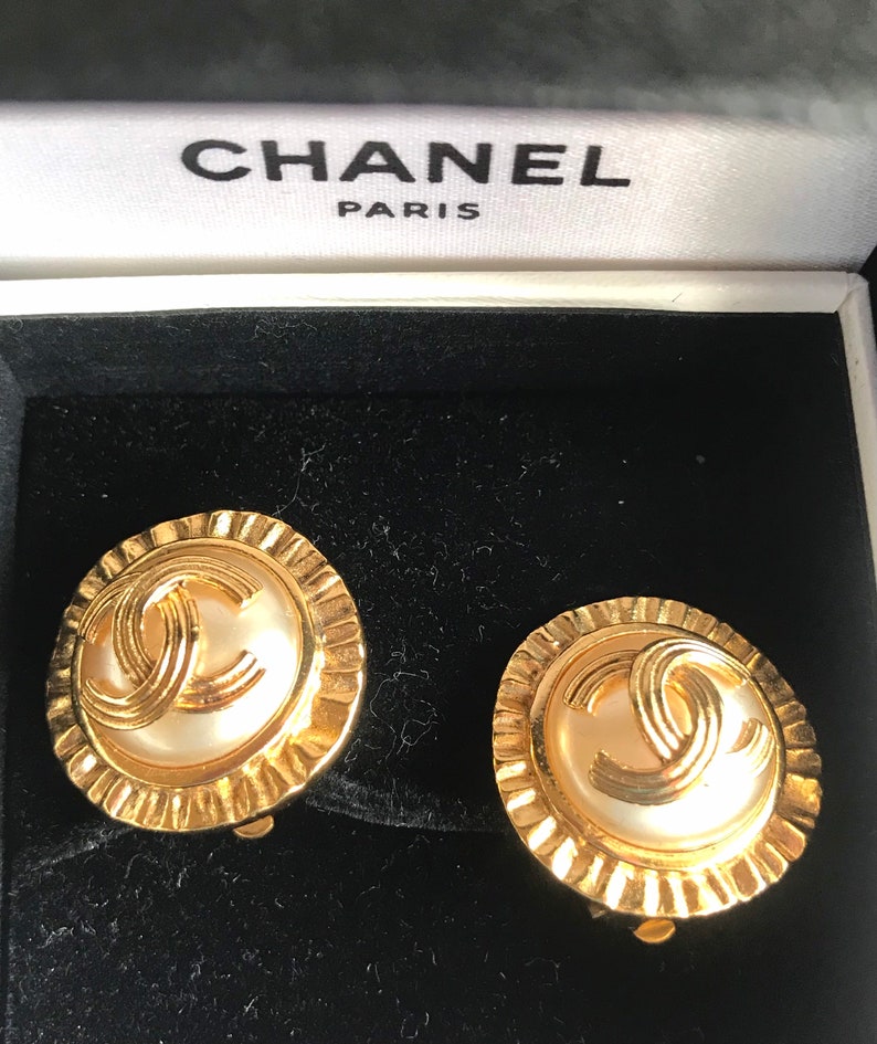 CHANEL Vintage golden round earrings with sun and CC mark motif faux pearl