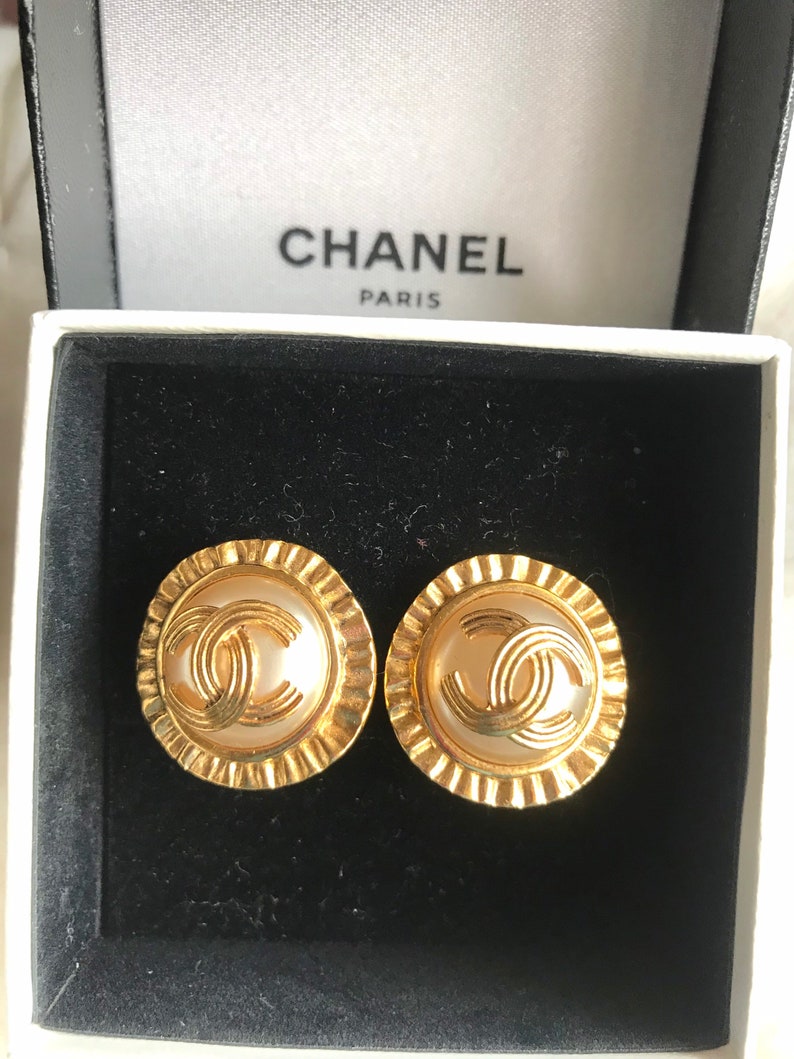 CHANEL Vintage golden round earrings with sun and CC mark motif faux pearl