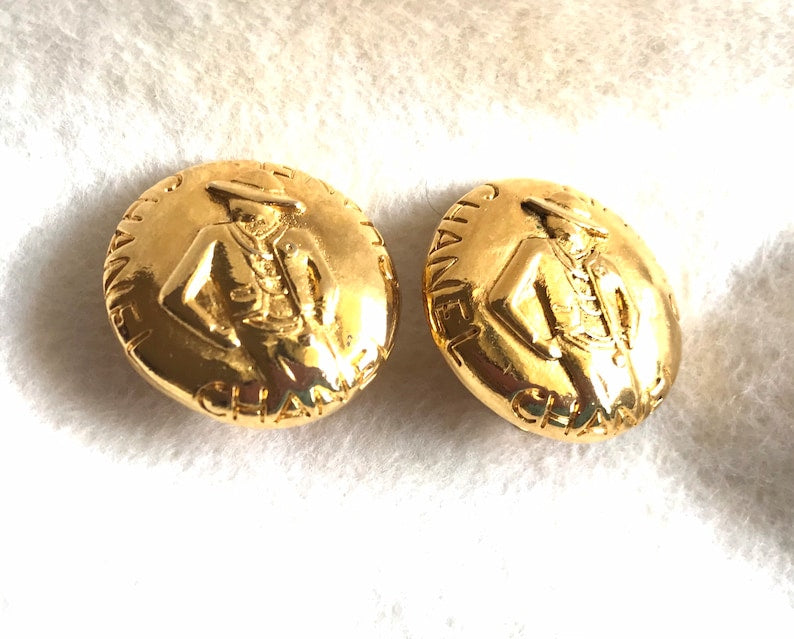 CHANEL Vintage gold tone round earrings with mademoiselle figure