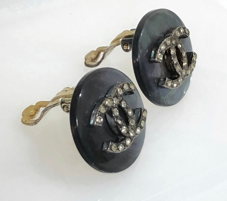 CHANEL Vintage black shell earrings with rhinestone crystal CC motif