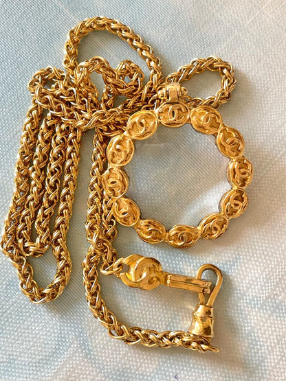 CHANEL Vintage long chain necklace with round glass loupe pendant top and CC motifs