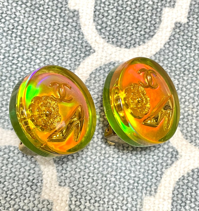 CHANEL Vintage yellow orange tone aurora resin earrings with iconic charms