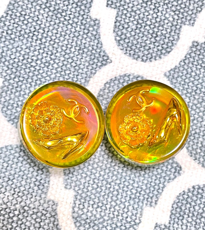 CHANEL Vintage yellow orange tone aurora resin earrings with iconic charms