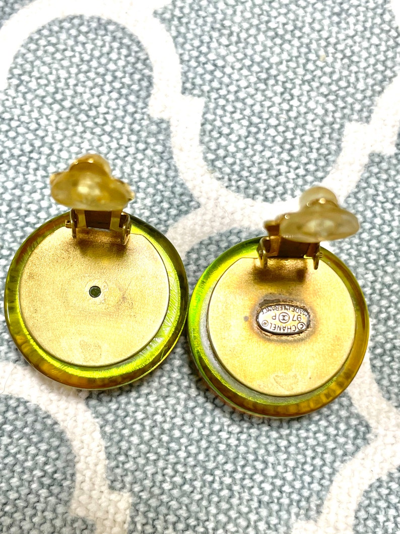 CHANEL Vintage yellow orange tone aurora resin earrings with iconic charms