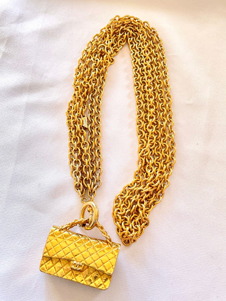 CHANEL Vintage golden triple chain long necklace with classic 2