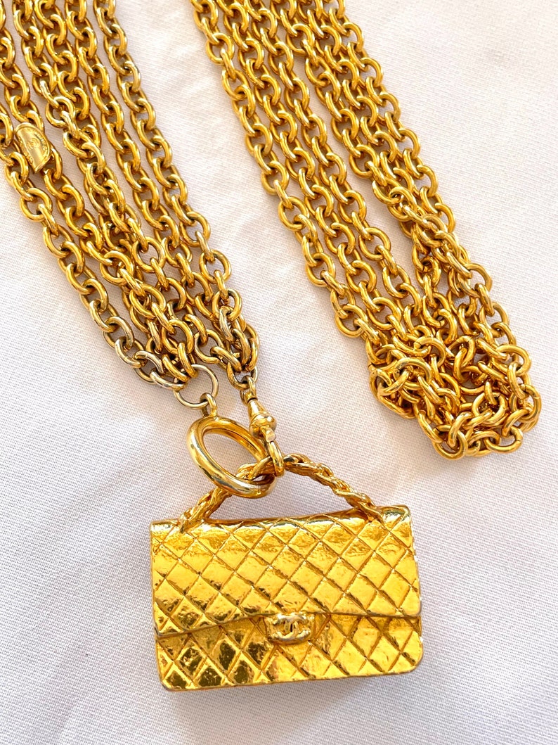 CHANEL Vintage golden triple chain long necklace with classic 2