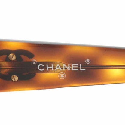 CHANEL Vintage brown frame and grey shade sunglasses with golden CC motifs at sides