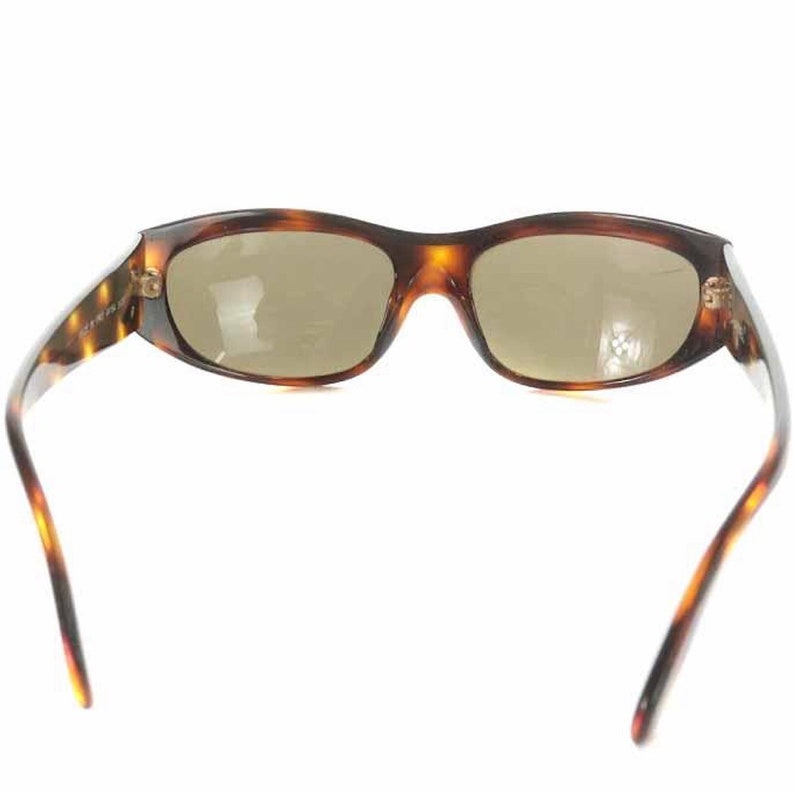 CHANEL Vintage brown frame and grey shade sunglasses with golden CC motifs at sides